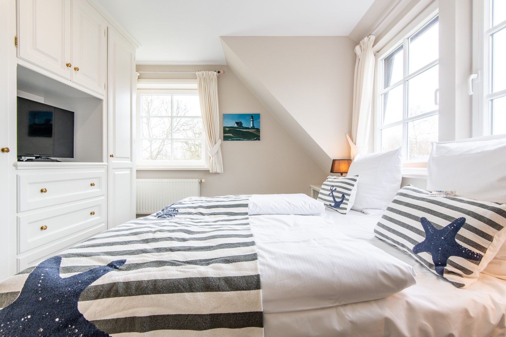 Schlafzimmer mit Doppelbett in Ferienhaus auf Sylt