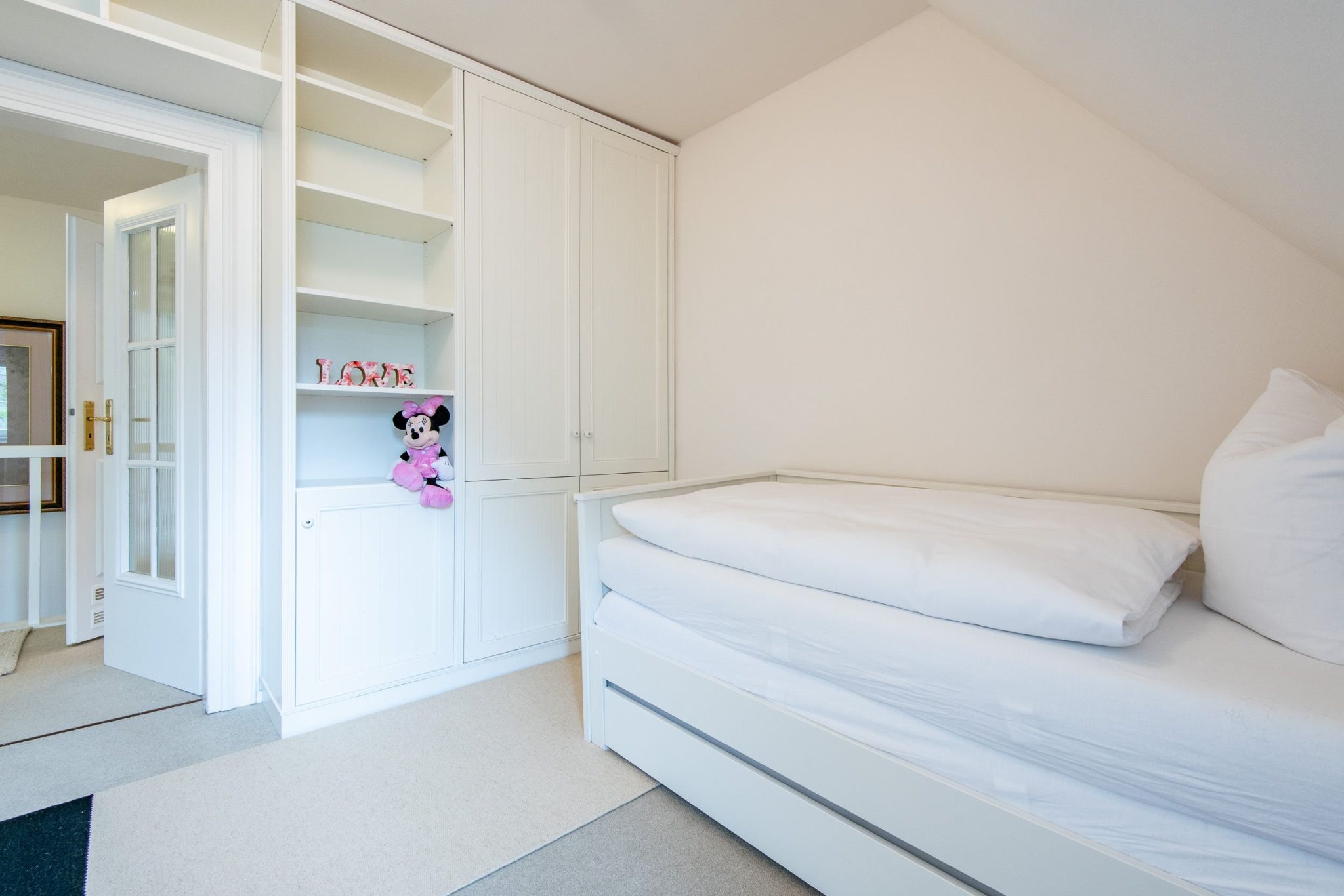 Schlafzimmer mit Einzelbett in Ferienhaus auf Sylt