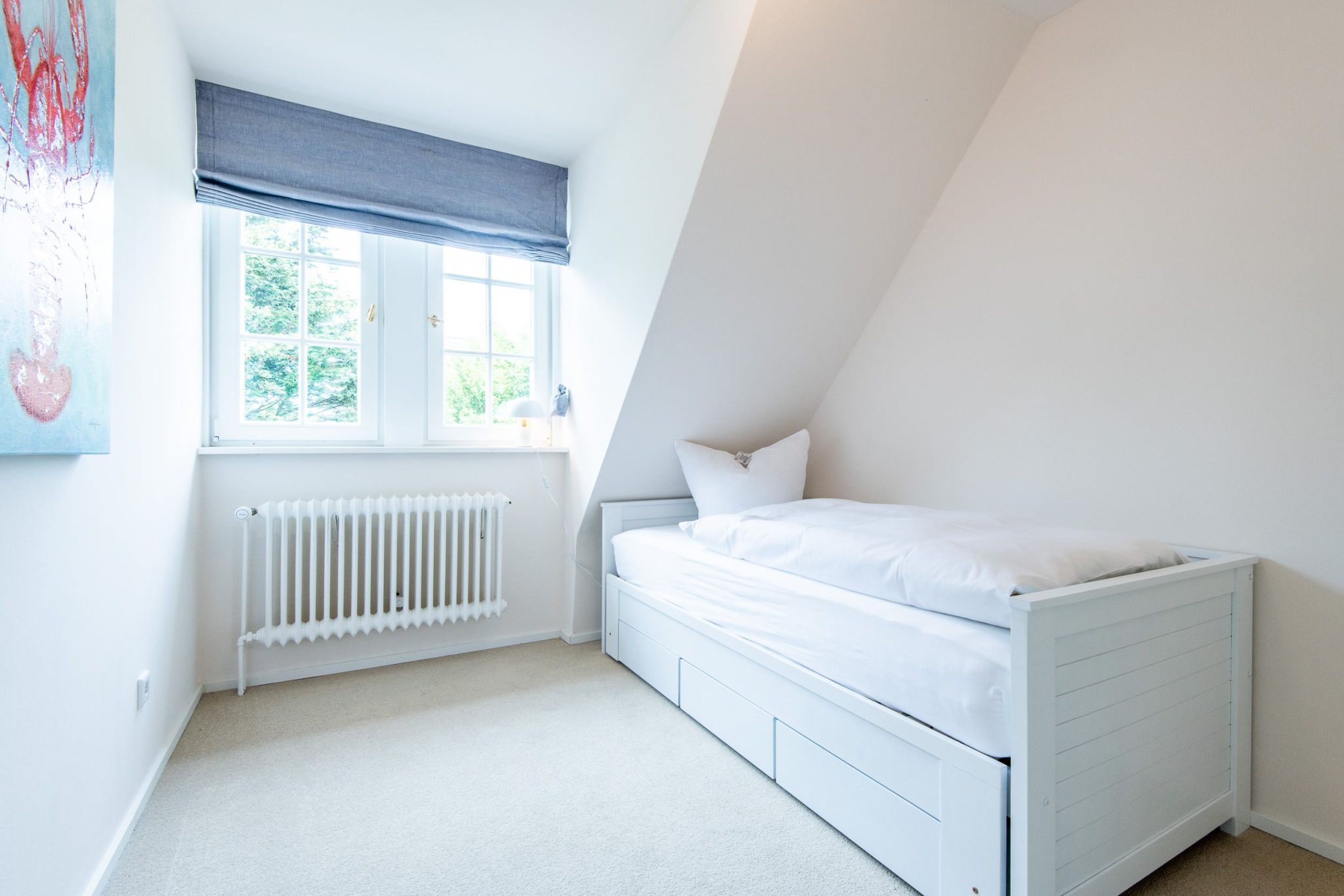 Schlafzimmer mit Einzelbett in Ferienhaus auf Sylt