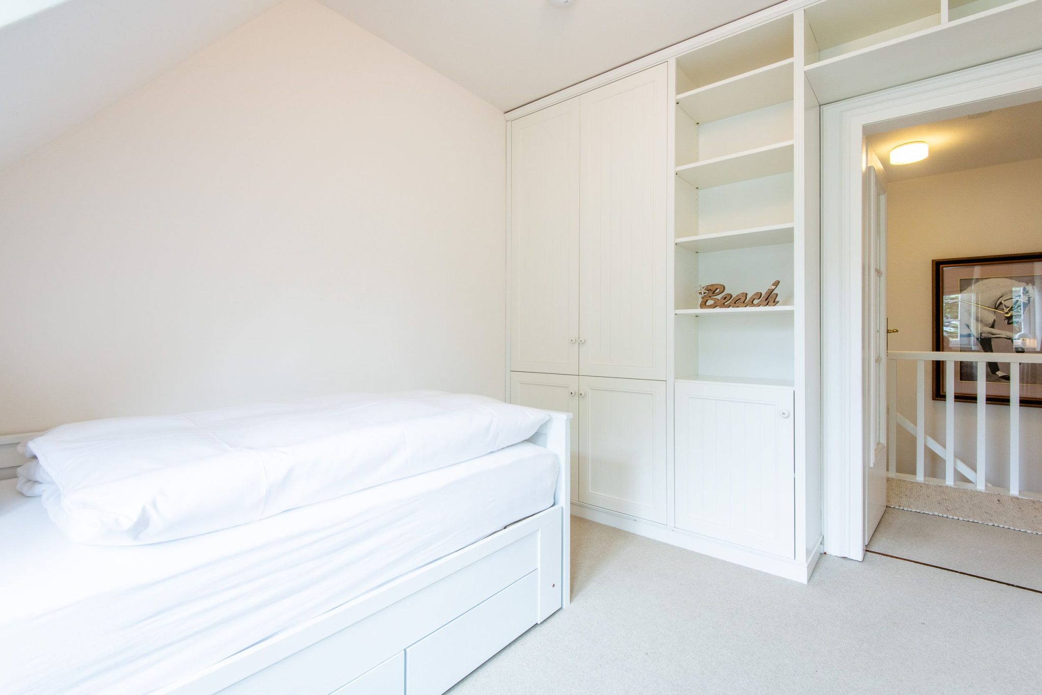 Schlafzimmer mit Einzelbett in Ferienhaus auf Sylt