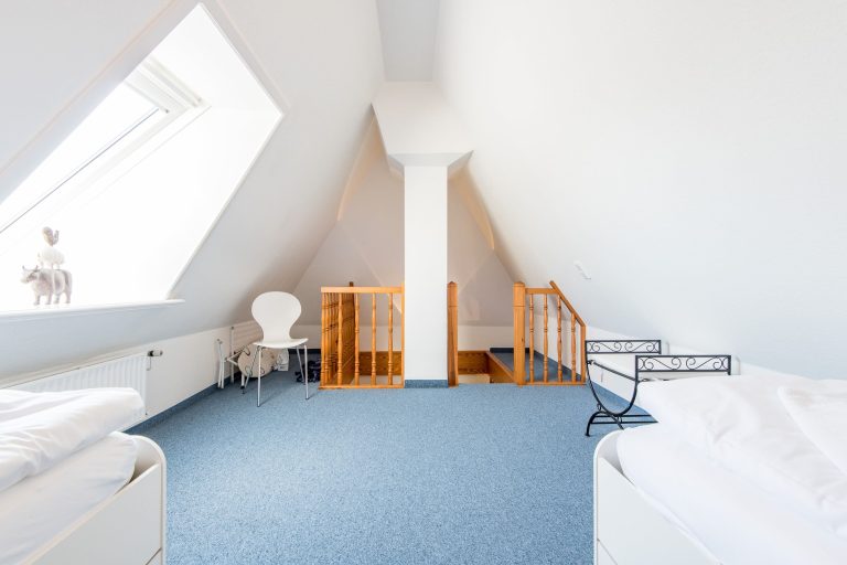 Schlafzimmer mit Einzelbetten in Ferienhaus auf Sylt