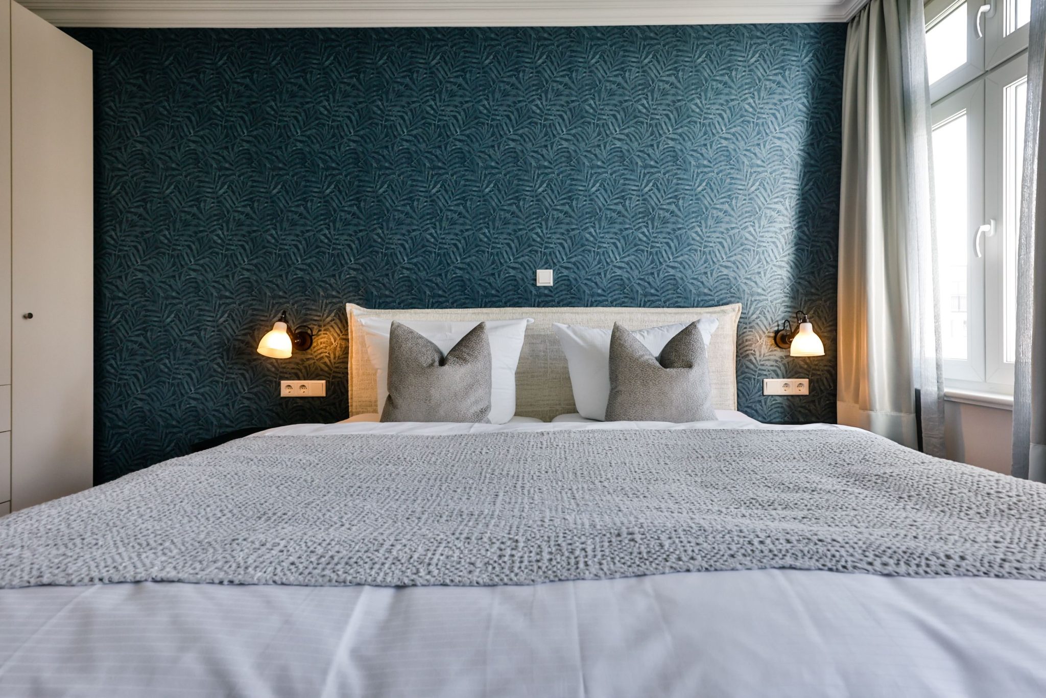 Schlafzimmer mit Doppelbett in Ferienwohnung auf Sylt
