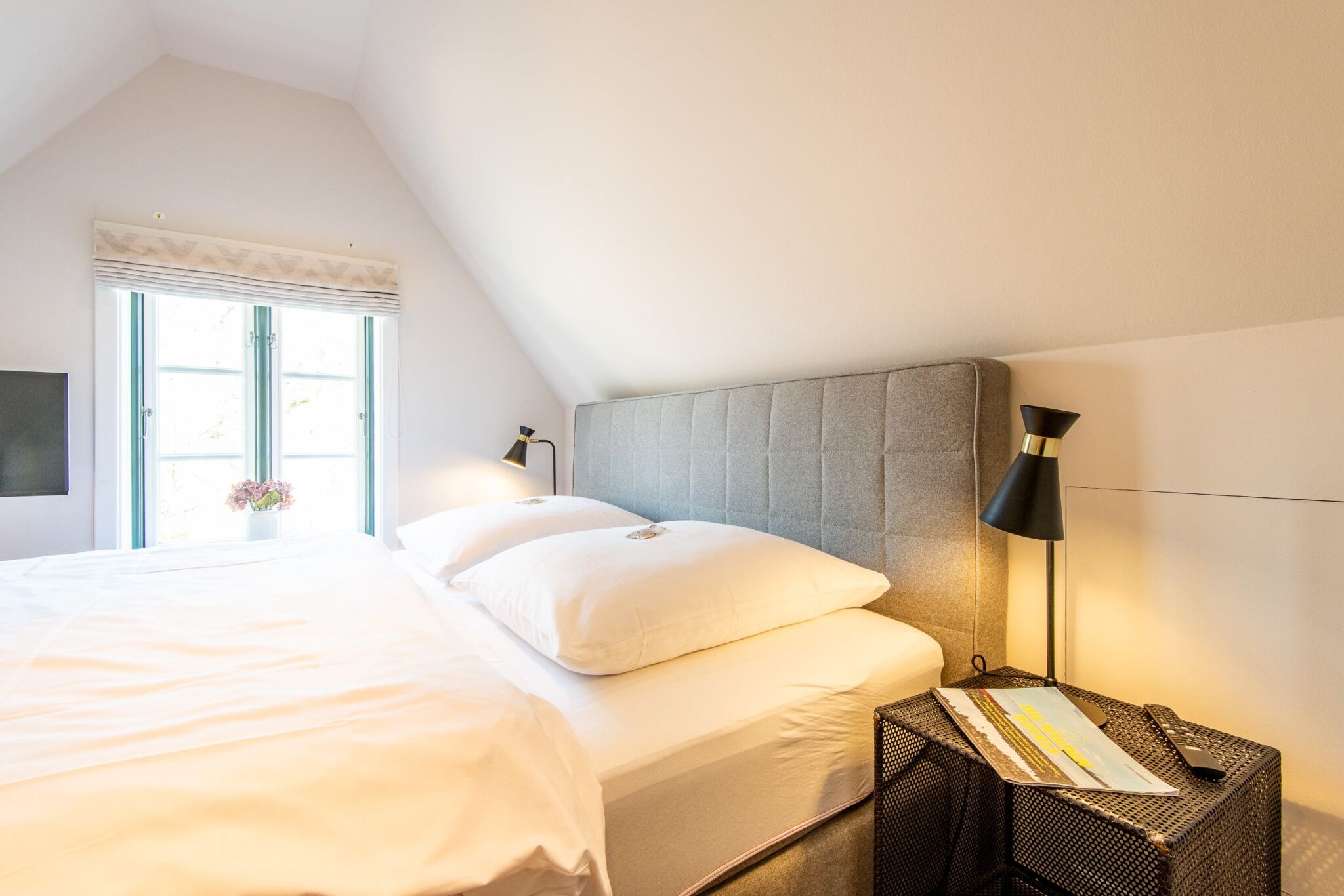 Doppelbett in einem Ferienhaus auf Sylt